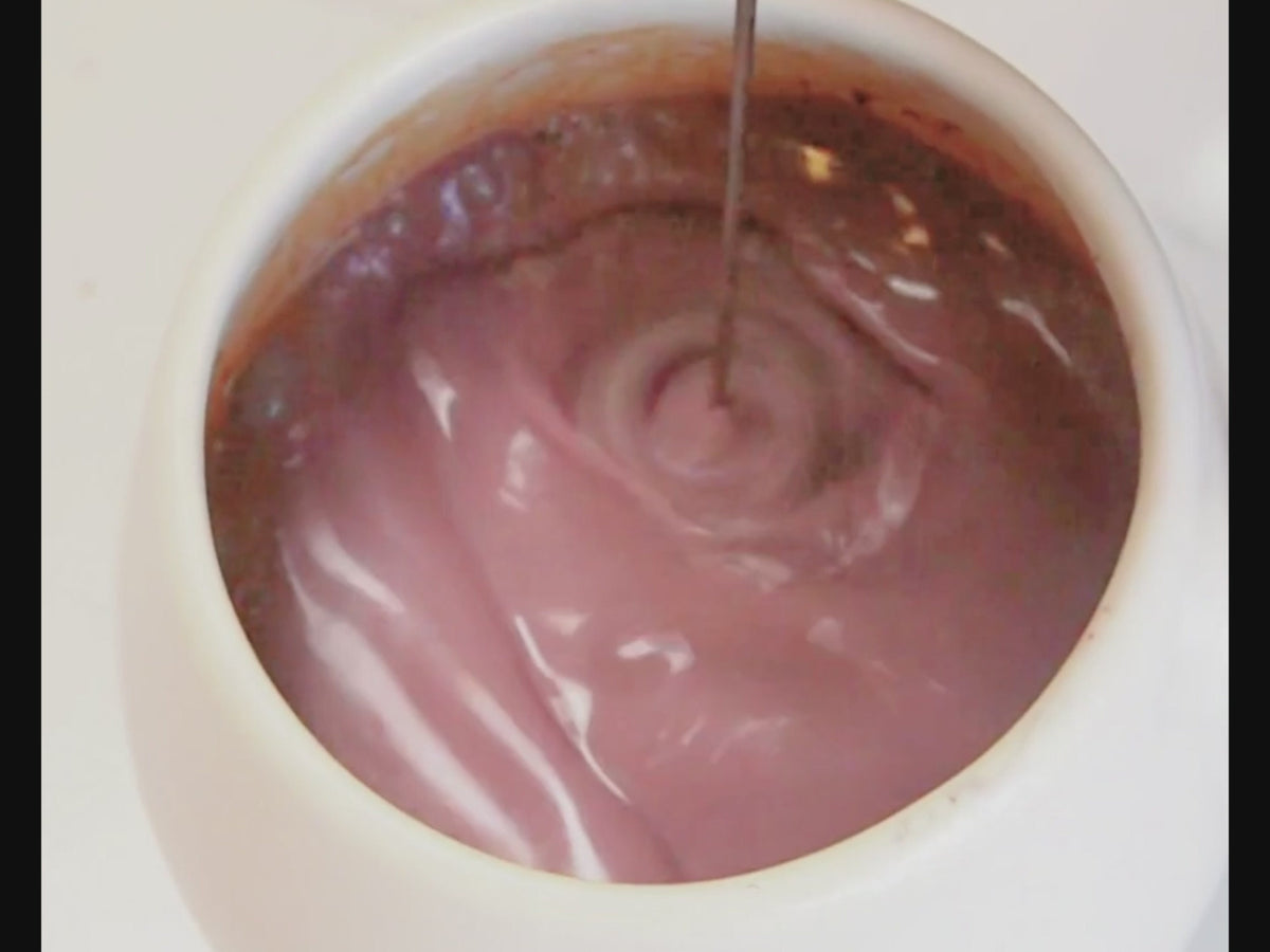 The mixing and frothering of a High Flavanol Cocoa Powder into a High Flavanol Hot Chocolate drink, perfect when it's cold outside. 