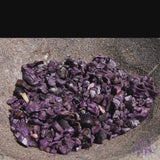 Organic Cocoa Nibs being ground up with a mortar and pastel. 